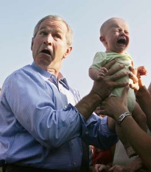 Bush and screaming baby - REUTERS/Jim Bourg (GERMANY)